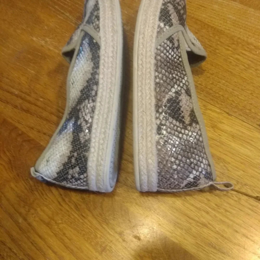 Clarks size 7 animal print slip on espadrilles. Comfort shoes.